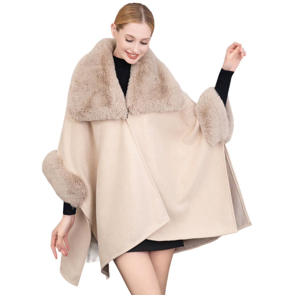 Beige Faux Fur Trimmed Solid Ruana Poncho. Crafted with a faux fur-trimmed and a smooth fabric, this poncho gives you the perfect cold-weather accessory. Layer over your favorite outfits and stay warm and stylish. Give the perfect winter gift to your family members, friends, loved ones, or yourself with this stylish poncho.