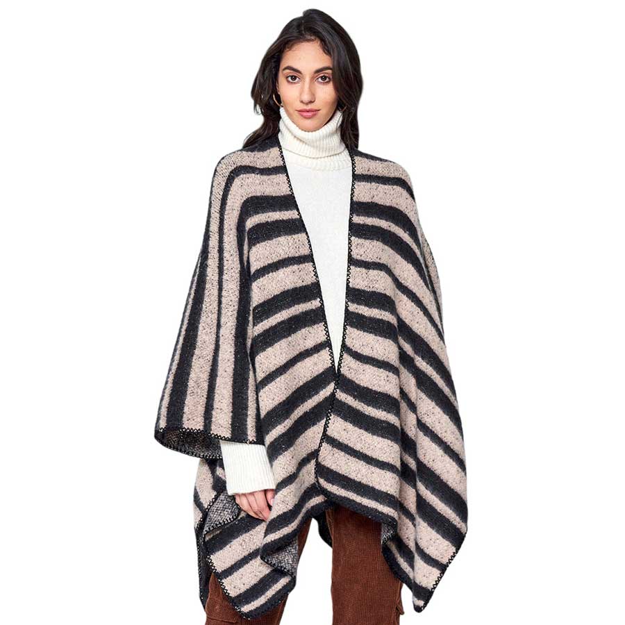 Beige Striped Cozy Two-Tone Knit Kimono Poncho, is crafted from a soft blend of quality materials for a comfortable, stylish look. The two-tone knit pattern ensures a unique, eye-catching piece. A thoughtful gift for fashion-loving friends and family members, special ones, colleagues, or Secret Santa gift exchange in winter.