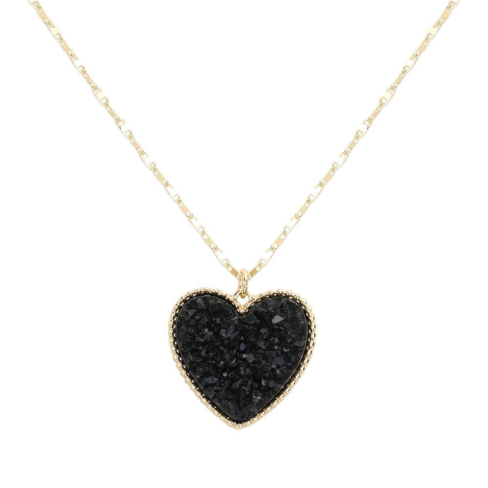 Black Druzy Heart Pendant Necklace, this is a stunning accessory that adds a touch of sparkle to any outfit. The druzy heart pendant is beautifully crafted and catches the light for a mesmerizing effect. With its unique design and high-quality materials, this necklace is sure to make a statement and elevate your look.