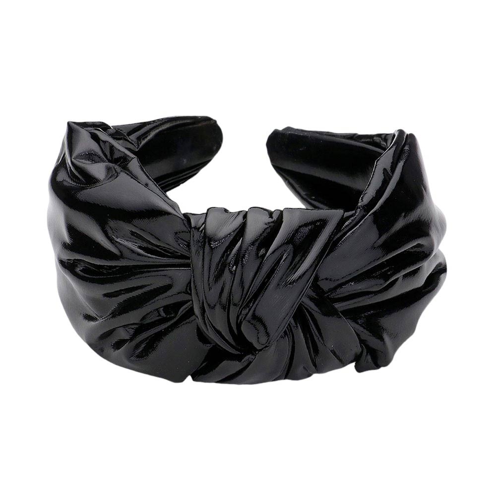Black Faux Shiny Leather Knot Headband, the perfect accessory for adding a touch of elegance to any outfit. Made from high-quality faux leather, this headband boasts a sleek and shiny finish. Its knot design adds a unique and stylish touch. This shiny headband is a perfect gift accessory for your loved ones.