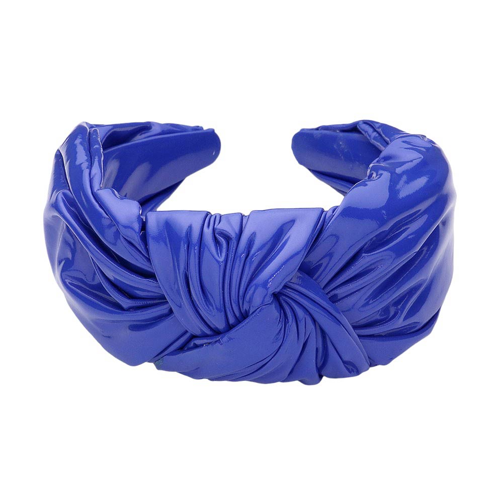 Blue Faux Shiny Leather Knot Headband, the perfect accessory for adding a touch of elegance to any outfit. Made from high-quality faux leather, this headband boasts a sleek and shiny finish. Its knot design adds a unique and stylish touch. This shiny headband is a perfect gift accessory for your loved ones.
