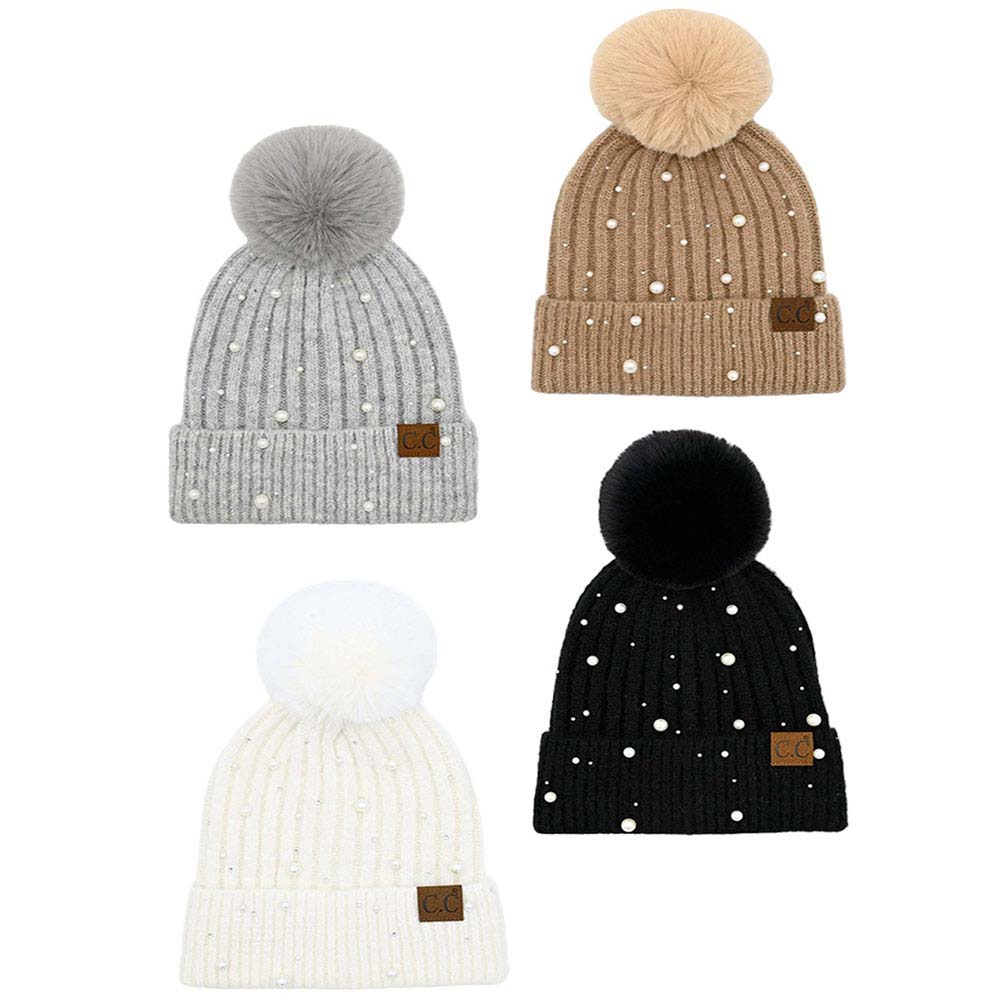 C.C Pearl Embellishments Pom Pom Beanie Hat, this stylish beanie is made from high-quality material for a comfortable and snug fit. Featuring pearl embellishments and a pom pom detail, this hat is sure to keep you looking stylish and chic in chilly weather. Perfect winter gift for friends and family.