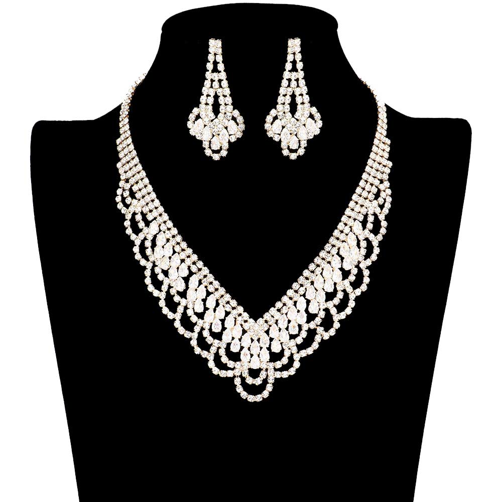 Gold CZ Teardrop Stone Detailed Jewelry Set. Adorn yourself in elegance and luxury with this. Accented with shimmering cubic zirconia, this statement-making jewelry set is sure to bring a touch of glamour to any ensemble. Crafted with meticulous attention to detail, this set is perfect for any special occasion or as a gift.