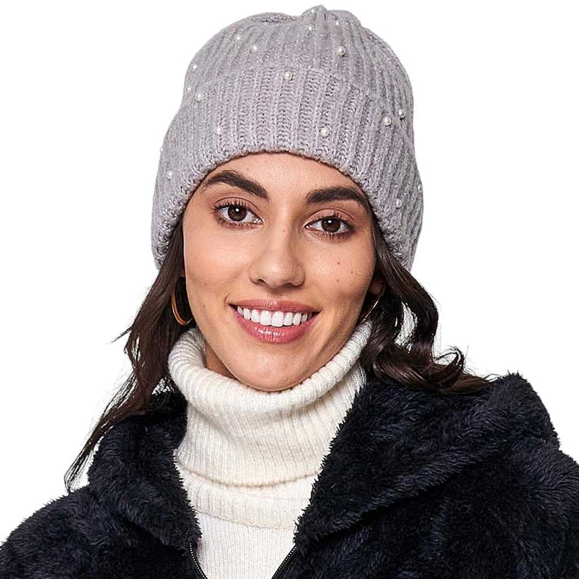 Black Knitted Pearl Beanie Hat, Stay warm in perfect style. This beanie is knitted with lightweight wool and features delicate pearl detailing for an effortless chic look. The lightweight wool helps to keep in warmth and is sure to be durable, keeping you warm for years to come. Nice and thoughtful gift idea in Cold Ace.