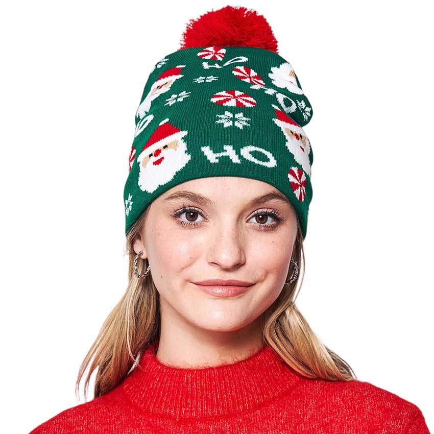 Black HoHoHo Message Santa Claus Candy Cane Pom Pom Beanie Hat. It's perfect for gifting to your loved ones on Christmas, or to treat yourself. Featuring an iconic message from Santa Claus himself, HoHoHo, this hat is perfect for spreading the cheer! It is an ideal winter accessory.