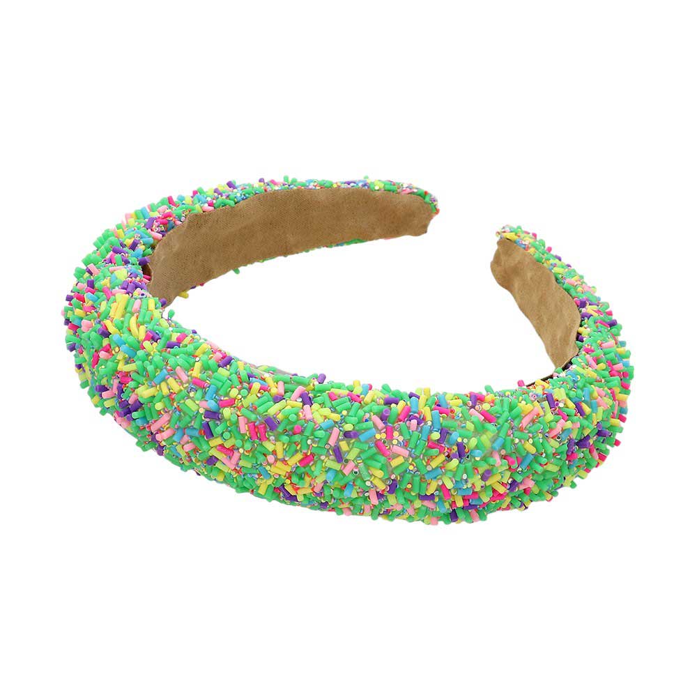 Green Sprinkle Beaded Headband. Upgrade your hair accessory game with our headband with the perfect blend of style and functionality, this headband adds a touch of elegance to any outfit. Made with precision and quality materials, it will elevate your look and keep your hair in place all day long.