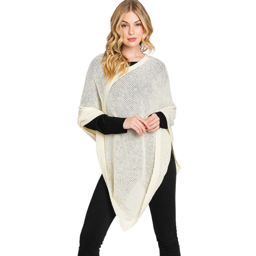 Black Solid Knit Loose Fit Poncho, Crafted from a comforting, arctic wool blend fabric, features a loose-fitting design that will keep you cozy without compromising on style. Perfect for day-to-day wear. Look stylish and stay warm in this stylish poncho. It can be a stylish gift to family members or fashion loving friends.