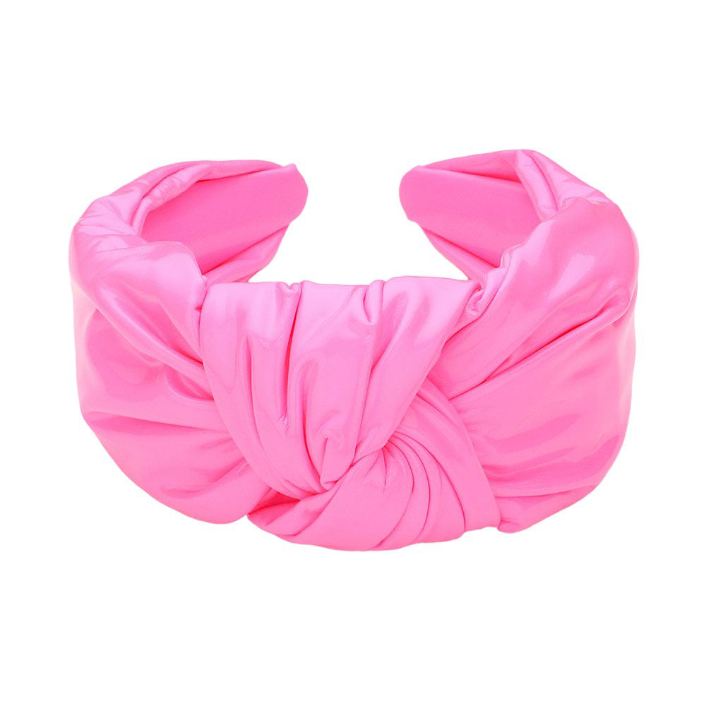 Light Pink Faux Shiny Leather Knot Headband, the perfect accessory for adding a touch of elegance to any outfit. Made from high-quality faux leather, this headband boasts a sleek and shiny finish. Its knot design adds a unique and stylish touch. This shiny headband is a perfect gift accessory for your loved ones.