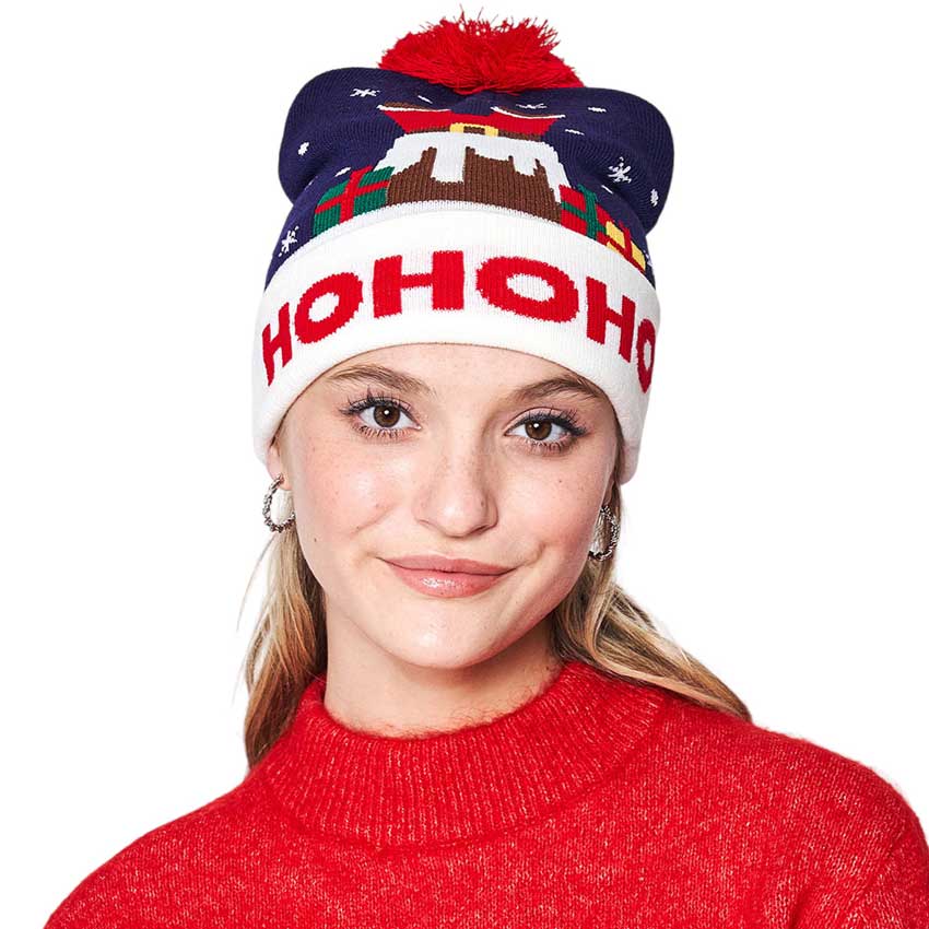 Navy HoHoHo Message Santa Claus Pom Pom Beanie Hat, is an ideal choice for gifting to your beloved ones in this Christmas season. The soft, comfortable material and cozy pom pom make this a stylish and comfortable choice. The festive, jolly "HoHoHo" embroidered patch provides a cheerful holiday touch.