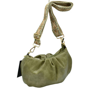 Olive Green Vegan Leather Guitar Strap Fashionable Women's Crossbody Bag, is perfect to carry all your handy items with ease. This vegan leather crossbody bag features a top zipper closure for security that makes your life easier and trendier. Its catchy and awesome appurtenance drags everyone's attraction to you. Great for different activities including quick getaways, attending parties, picnics, beach, etc! It's very easy to carry with your hands.