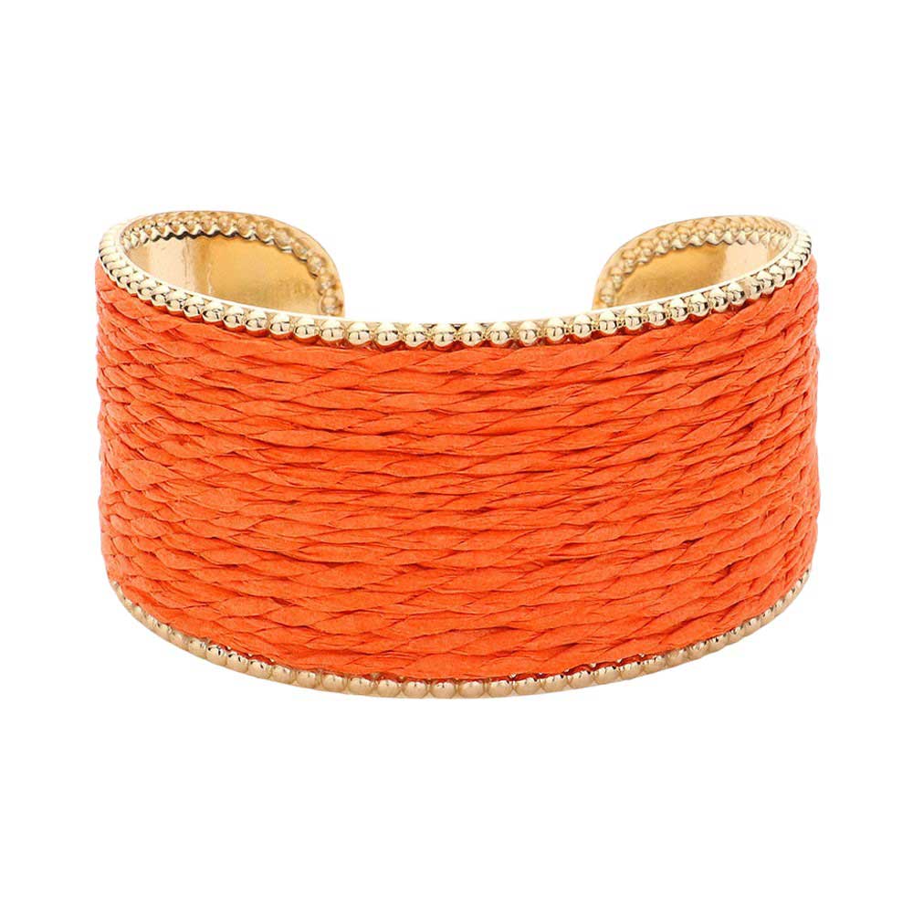 Orange Raffia Cuff Bracelet, Introducing a unique addition to your jewelry collection. Made from versatile raffia, this cuff offers a touch of natural elegance to any outfit. Its lightweight design ensures all-day comfort. Perfect for giving a lovely gift to someone you love and care about. Elevate your style with this.