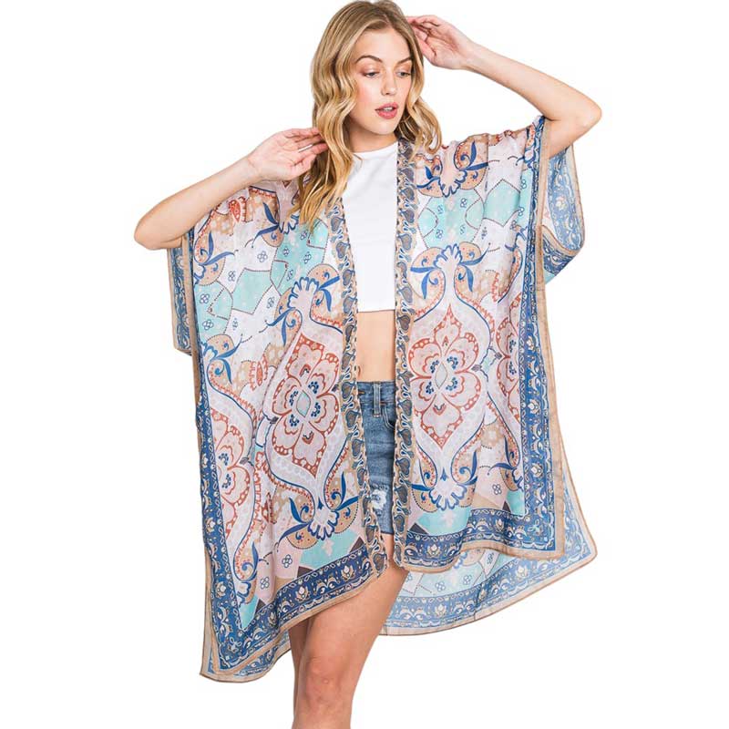 Turquoise Abstract Paisley Print Kimono Poncho, Expertly crafted with an abstract paisley print, this kimono poncho is a versatile addition to any wardrobe. Made with lightweight, breathable material, it's perfect for layering over any outfit for a chic look. Enjoy the unique design and comfortable fit of this statement piece.