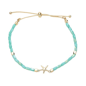 Turquoise Metal Starfish Pointed Faceted Beaded Pull Tie Cinch Bracelet! Perfect for any occasion, this bracelet features a stunning metal starfish charm and intricately faceted beads that add a touch of elegance and style. Elevate your look and make a statement with this unique and versatile bracelet.