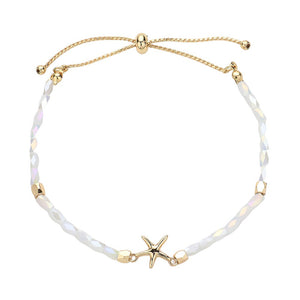White Metal Starfish Pointed Faceted Beaded Pull Tie Cinch Bracelet! Perfect for any occasion, this bracelet features a stunning metal starfish charm and intricately faceted beads that add a touch of elegance and style. Elevate your look and make a statement with this unique and versatile bracelet.
