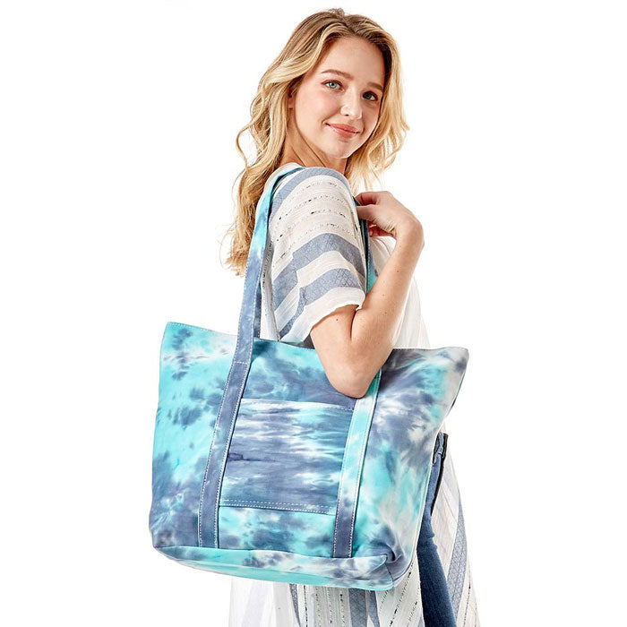 Blue Tie Dye Tote Bag, this bright tote bag is the perfect accessory. Whether you are out shopping, going to the pool or beach, this Tie Dye Tote bag is the perfect accessory. Spacious enough for carrying any and all of your outside essentials. The soft strap really helps carrying this tie dye shoulder bag comfortably.