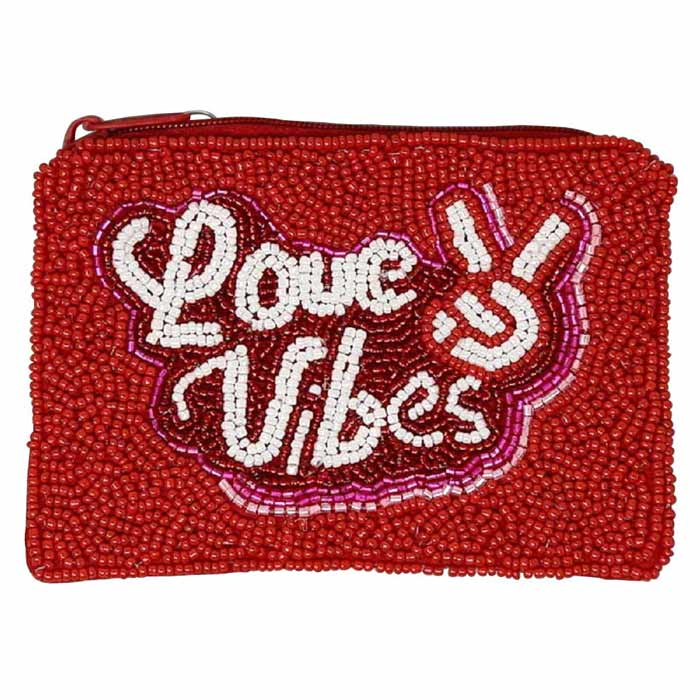 Red LOVE VIBES Seed Beaded Coin Purse, a beautiful accessory that is going to be your absolute favorite new purchase! It features a beautiful seed-beaded design, a LOVE VIBES message with an upper zipper closure & attractive valentine's theme. Ideal for keeping your phone, money, bank cards, lipstick, coins, and other small essentials in one place. It's versatile enough to carry with different outfits throughout the week. 