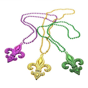 Mult Purple Fleur-de-lis pendant necklace set designed with a bold emblem charm and classic beaded chain for statement appeal. Ideal for celebrations, themed events, parades, and party styling, these necklaces add iconic flair and playful character to outfits while remaining lightweight and easy to wear.