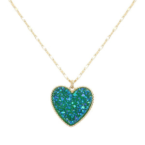 AB Emerald Druzy Heart Pendant Necklace, this is a stunning accessory that adds a touch of sparkle to any outfit. The druzy heart pendant is beautifully crafted and catches the light for a mesmerizing effect. With its unique design and high-quality materials, this necklace is sure to make a statement and elevate your look.