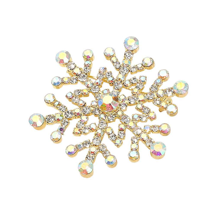 Elegant snowflake brooch pin adorned with sparkling rhinestones in a dazzling winter design. Perfect accessory for coats, scarves, and holiday outfits, adding festive sparkle and seasonal charm to any look. A perfect gift for Christmas.