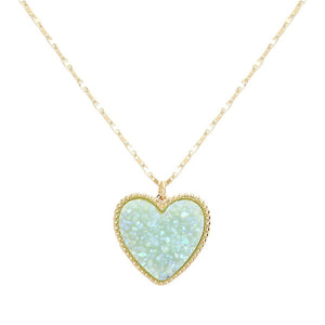 AB Opal Druzy Heart Pendant Necklace, this is a stunning accessory that adds a touch of sparkle to any outfit. The druzy heart pendant is beautifully crafted and catches the light for a mesmerizing effect. With its unique design and high-quality materials, this necklace is sure to make a statement and elevate your look.