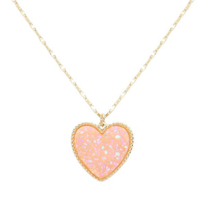 AB Pink Druzy Heart Pendant Necklace, this is a stunning accessory that adds a touch of sparkle to any outfit. The druzy heart pendant is beautifully crafted and catches the light for a mesmerizing effect. With its unique design and high-quality materials, this necklace is sure to make a statement and elevate your look.