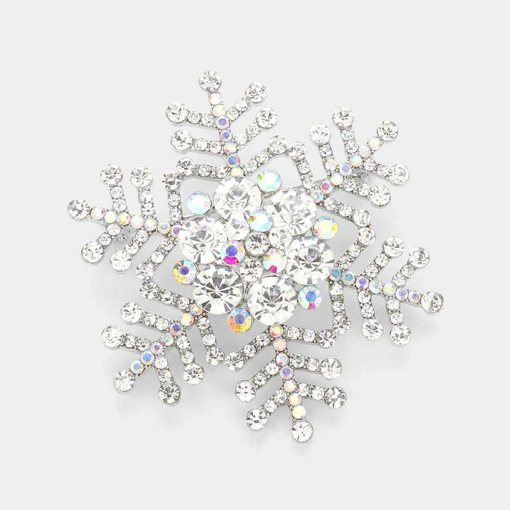 Elegant snowflake brooch pin adorned with sparkling rhinestones, perfect for adding a festive touch to winter outfits, coats, scarves, or hats. Ideal accessory for holiday parties, weddings, or as a thoughtful seasonal gift. A stylish way to showcase charm and elegance during the winter season.
