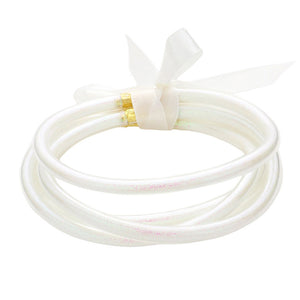 AB White 5PCS Glitter Jelly Tube Bangle Bracelets, these 5 colorful, glittered bracelets are perfect for adding a fashionable yet eye-catching touch to any outfit. Made from jelly tubes and shimmering glitter, they are durable and comfortable to wear. Add a pop of color and sparkle to your wardrobe with these stylish bracelets.
