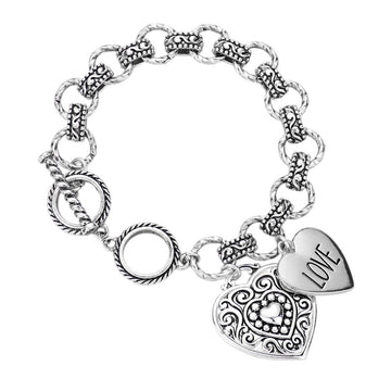 Antique Silver Antique Metal Heart Charm Toggle Bracelet features a timeless design that adds a touch of elegance to any outfit. Made with high-quality antique metal and featuring a heart charm toggle, this bracelet is a must-have for any fashion-forward individual. Its vintage-inspired look is perfect for any occasion, making it a versatile and stylish addition to your jewelry collection.
