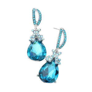 Aqua Teardrop Crystal Rhinestone Evening Earrings, are the perfect accessory for any special occasion. Each earring features a teardrop-shaped crystal encrusted in rhinestones for a glamorous sparkle and shine. High-quality stones are set securely in the design. A timeless gift piece that will sparkle for years.