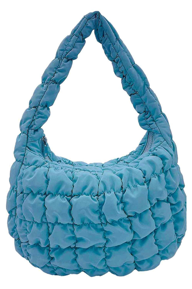 Aqua Compact quilted bag crafted from durable 100% polyester with a timeless solid design. Measuring 8.7" x 11.8" x 3.15", it's the perfect size for everyday essentials, travel accessories, or as a versatile organizer. The quilted texture adds visual interest and subtle structure. Ideal for on-the-go convenience with a sleek, minimalist aesthetic that pairs effortlessly with any outfit.