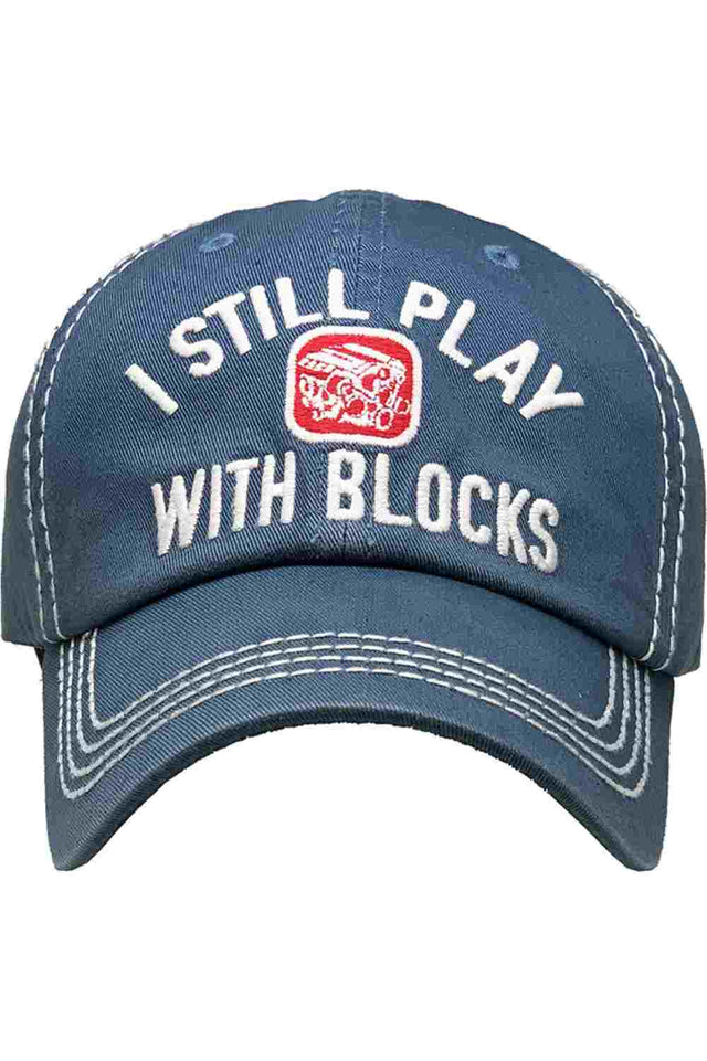 Blue Show off your playful side with the I Still Play Blocks Vintage Baseball Cap, featuring a distressed finish and classic curved brim for effortless everyday style. Made from soft, breathable cotton with an adjustable back strap, this cap offers a comfortable fit while adding a fun retro touch to any casual outfit.