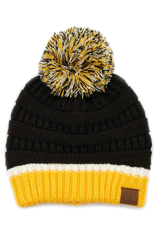 Black Gold The C.C Team Color Ribbed Beanie combines style and comfort in one versatile piece. Crafted from 100% acrylic, this beanie features a classic ribbed knit design with a playful pom on top, making it perfect for staying warm during chilly days.