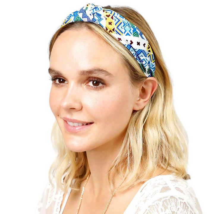 Blue Aztec Patterned Burnout Knot Headband is expertly crafted and features a unique design. Its trendy Aztec pattern and comfortable knot design are perfect for adding a touch of style to any outfit. Made with high-quality materials, it provides both functionality and fashion.