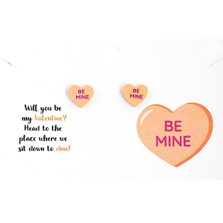 Be Mine Message Heart Stud Earrings are a charming way to express your love. Expertly crafted, these intricately designed hearts feature the words 'Be Mine' elegantly etched into them. Made with high-quality materials, these earrings are the perfect gift to show your affection. 