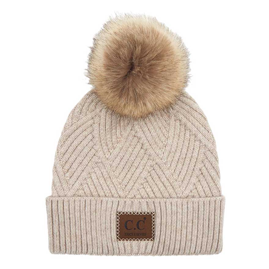 C.C Heather Beanie Hat With Pom Pom And Suede Patch, provides excellent protection and a fashionable look with its soft heather knit material, faux fur pom pom, and stylish suede patch. The fabric is designed to keep you comfortably warm in cold weather. Add this fashionable accessory to the winter wardrobe collection.