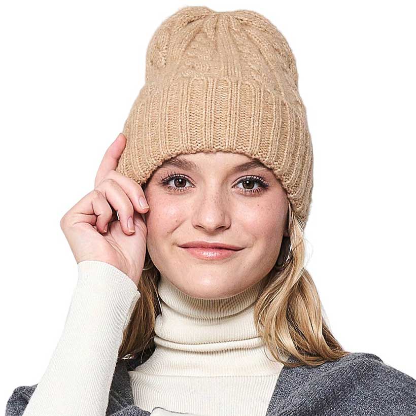 Beige Solid Cable Knit Beanie Hat, Stay warm in style. Crafted with a soft, 100% acrylic fabric, this hat is perfect for cold weather days. The knit design ensures maximum comfort and breathability, while providing great protection from the cold. Enjoy this stylish and functional winter accessory. Ideal winter gift idea.
