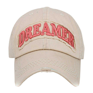 Beige Dreamer Message Vintage Baseball Cap, is crafted from durable cotton twill. It features an adjustable strap with an antique brass buckle for a snug fit and a unique vintage look. The bold printed message displays the wearer's commitment to their dream. Get the perfect fit and stylish look with this one-of-a-kind cap.