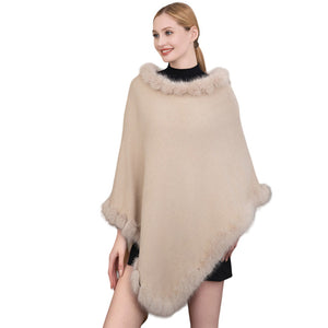 Beige Faux Fur Trimmed Solid Poncho, ensure your upper body stays perfectly warm when the temperatures drop. You can wear it as a casual outfit! A fashionable eye-catcher will quickly become one of your favorite accessories, warm, and goes with all your winter outfits. Perfect winter gift for your loved ones.