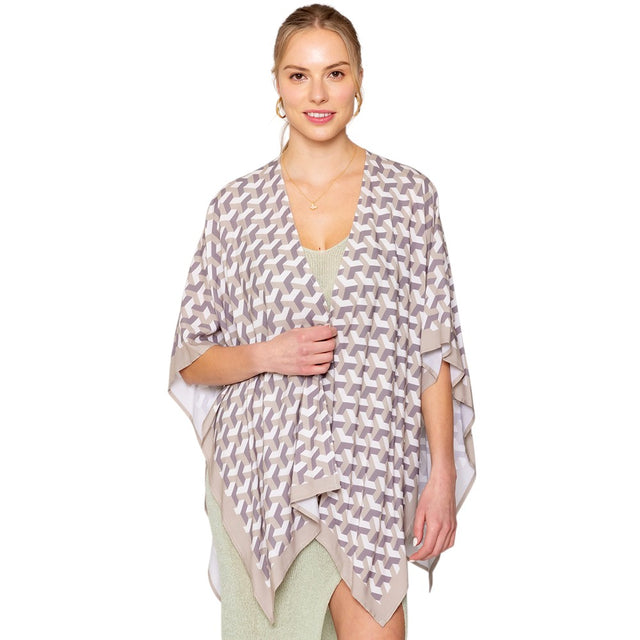 Beige Geometric Pattern Print Ruana Poncho is a must-have addition to your wardrobe. Crafted with a unique geometric pattern, this poncho adds a touch of modern style to any outfit. Made with high-quality materials, it provides both comfort and durability. Perfect for any occasion, this versatile piece is a statement piece you won't miss out on. 