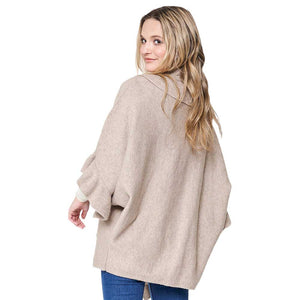 Beige Ruffle Knit Cardigan, Featuring a unique ruffle detailing and crafted from soft knit fabric, this cardigan offers both comfort and style. Perfect for layering with your winter wardrobe, you'll feel comfortable and fashionable in any situation. Ideal winter gift to fashion forwarded friends and family members.