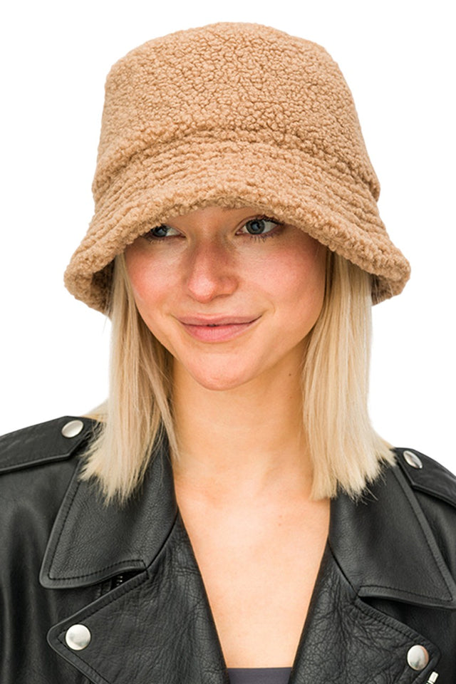 Beige Sherpa Fleece Cozy Winter Bucket Hat delivers superior thermal insulation while maintaining a lightweight feel. The structured design provides comprehensive coverage for optimal warmth retention, while the textured exterior adds distinctive style. Ideal for cold-weather activities with its durable construction and moisture-wicking properties that maintain comfort during extended wear.