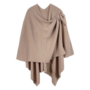 Beige Shoulder Strap Solid Ruana Poncho, with the latest trend in ladies outfit cover-up! the high-quality bling border solid neck poncho is soft, comfortable, and warm but lightweight. Stay protected from the chilly weather while taking your elegant looks to a whole new level with an eye-catching, luxurious outfit women! 