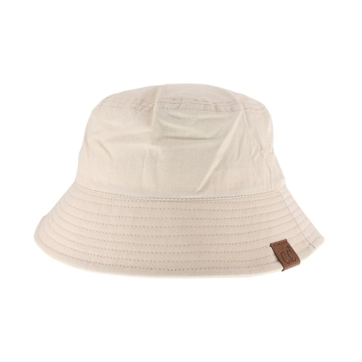 Beige Solid Cotton C.C Bucket Hat is expertly crafted from durable, breathable cotton fabric, ensuring all-day comfort and long-lasting wear. Its classic bucket design provides effective sun protection with a structured brim that shields your face and eyes from harmful UV rays. Ideal for outdoor activities or casual wear, this hat combines practical functionality with a timeless, versatile style.
