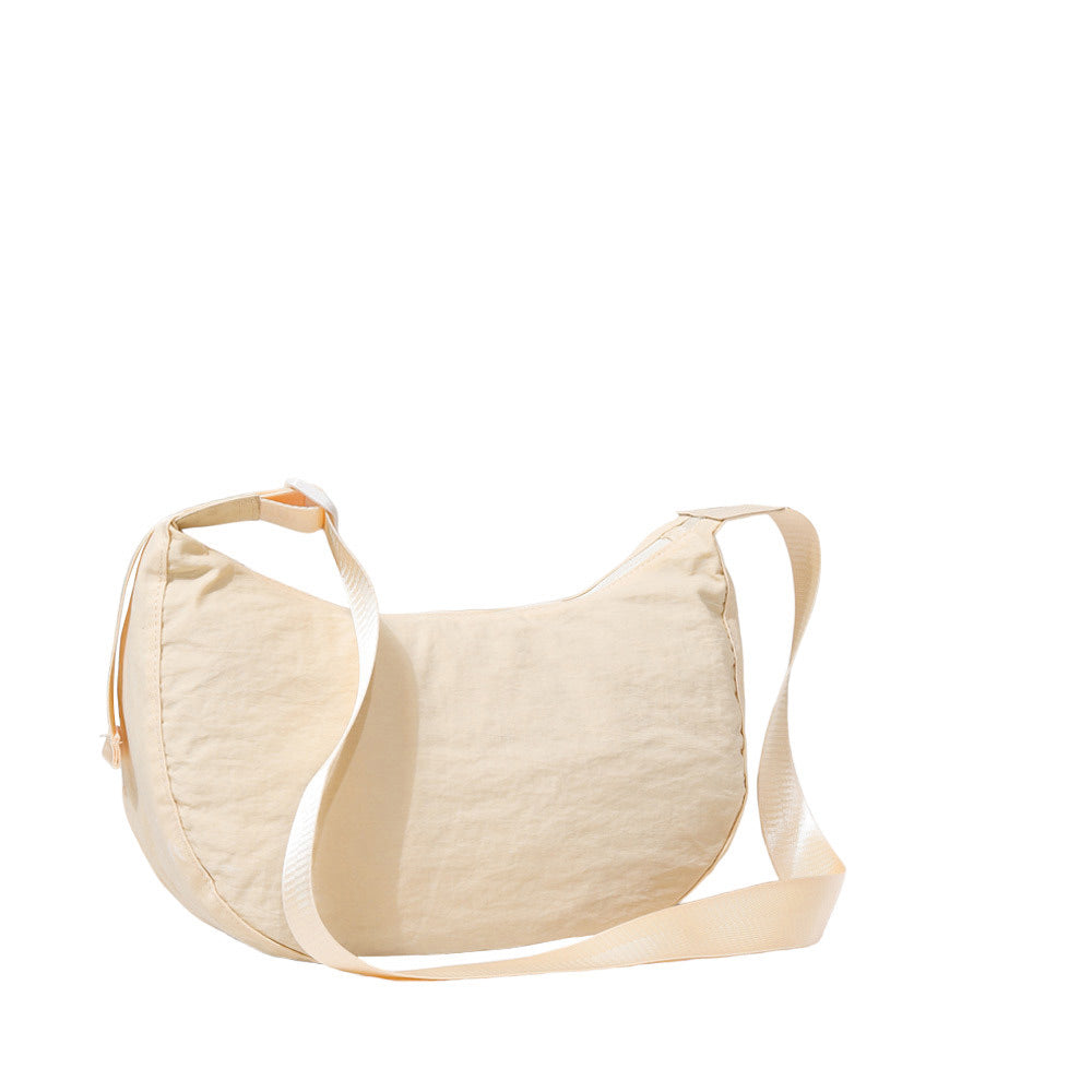 Beige Solid Nylon Sling Bag Crossbody Bag, is perfect to carry all your handy items with ease. This handbag features a top zipper closure for security that makes your life easier and trendier. This is the perfect gift idea for a birthday, holiday, Christmas, anniversary, Valentine's Day, etc.