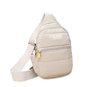 Beige Solid Puffer Mini Sling Bag, be the ultimate fashionista while carrying this Solid Puffer Sling bag in style. It's great for carrying small and handy things. Keep your keys handy & ready for opening doors as soon as you arrive. The adjustable lightweight features room to carry what you need for long walks or trips.
