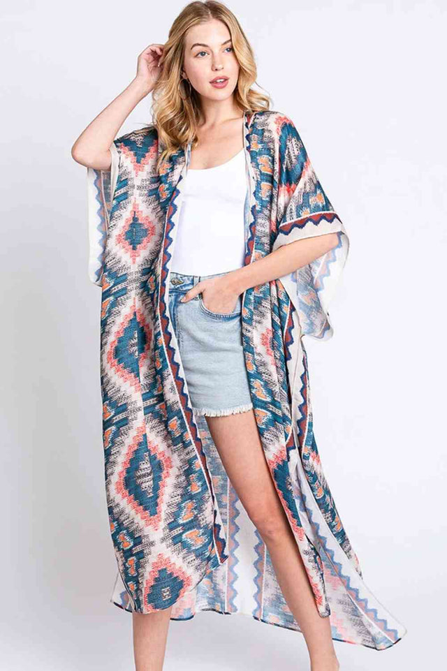 Beige Embrace bohemian elegance with this Aztec Print Open Front Long Kimono. Featuring a striking geometric pattern inspired by traditional Aztec designs, this lightweight piece drapes beautifully over any outfit. The open front silhouette offers effortless layering versatility, while the generous 35" x 47.5" dimensions provide comfortable coverage. Crafted from 100% polyester for easy care and durability. Perfect for adding texture and cultural flair to your everyday wardrobe or beach getaway.