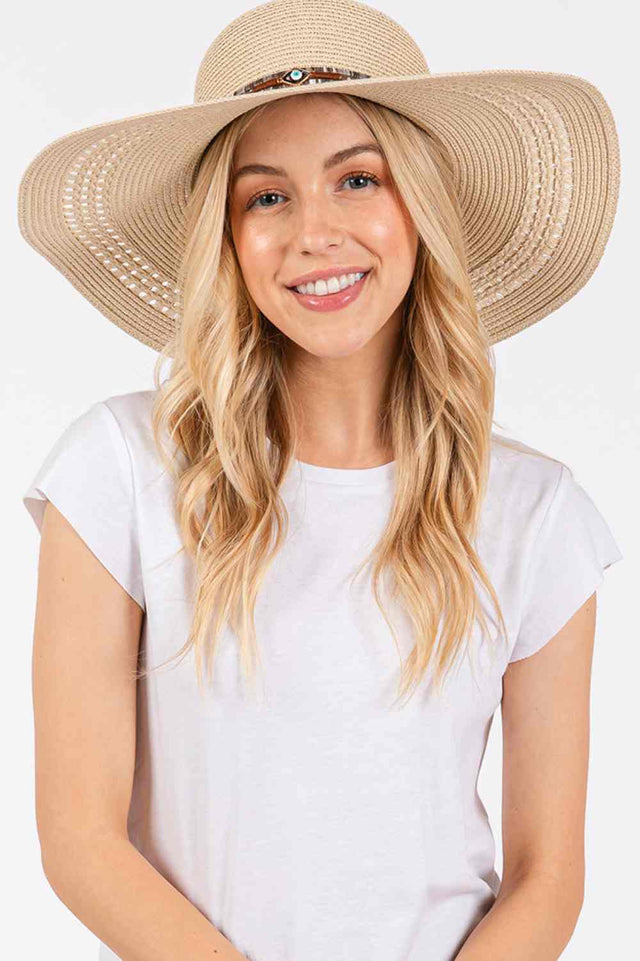 Beige Stay protected from the sun in style with this wide-brim straw hat featuring an eye-catching evil eye and multi-design band. Crafted from 100% paper material, the 5" brim delivers excellent UV protection while the lightweight construction keeps you cool during summer outings.
