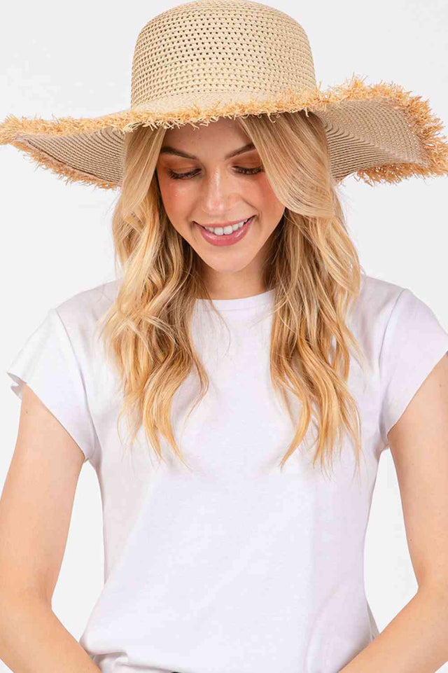 Beige Embrace effortless summer style with this frayed-edge two-tone floppy straw hat. Crafted from 100% paper, it offers a lightweight, breathable design perfect for sunny days. The wide brim provides excellent sun protection while the textured frayed edges add a relaxed, on-trend aesthetic.