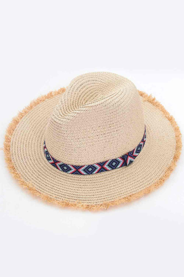 Beige Elevate your summer wardrobe with this Frayed Trim Aztec Straw Hat, a versatile accessory perfect for beach days and outdoor adventures. Crafted from 100% paper, this lightweight hat offers breathable comfort while the wide brim shields you from the sun's rays. Whether you're lounging poolside or exploring sun drenched destinations, this hat combines style and practicality for effortless seasonal appeal.