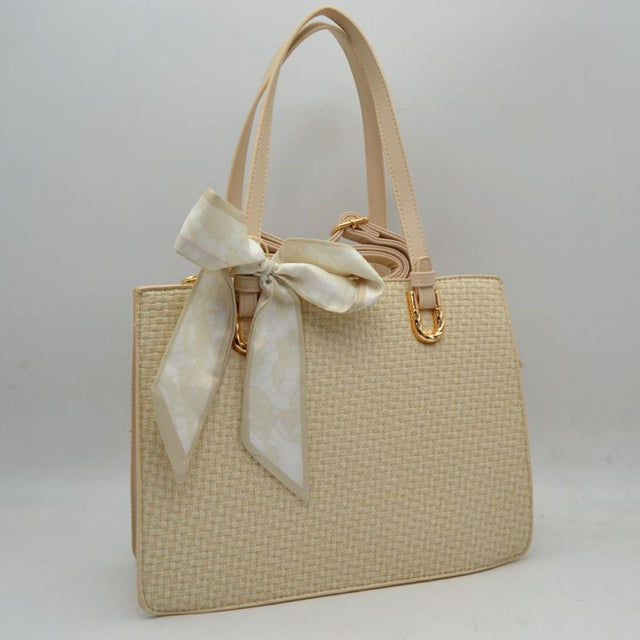 Beige Embrace a perfect blend of seasonal charm and sophisticated style with this elegant woven straw satchel bag. Designed with a beautifully textured basket-weave exterior body and smooth top trim panels, this handbag features a stylish patterned scarf tied in a bow at the handle base for a chic, feminine touch. The structured silhouette opens to a spacious main compartment that easily accommodates your daily essentials, making it an ideal companion for warm-weather outings, brunch, or casual workdays.